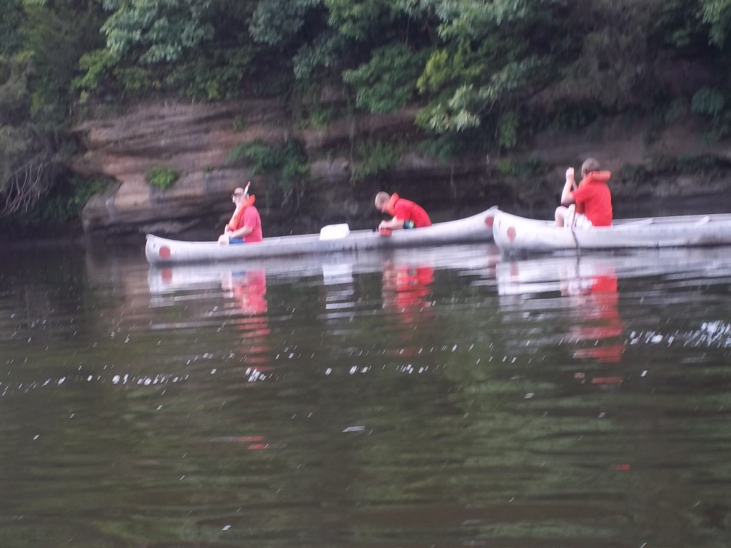2 canoes paddling