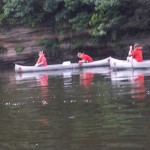 2 canoes paddling