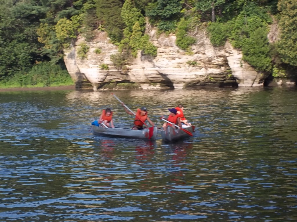 2 canoes paddling and racing