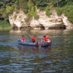 2 canoes paddling and racing